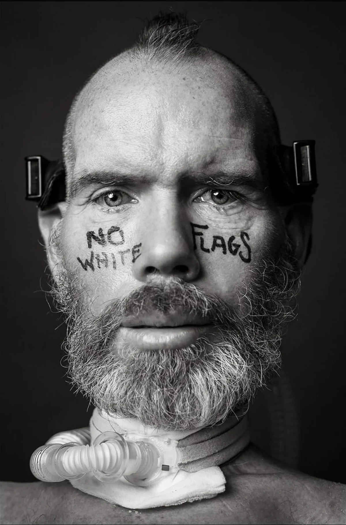 Steve Gleason with No White Flags written on his face