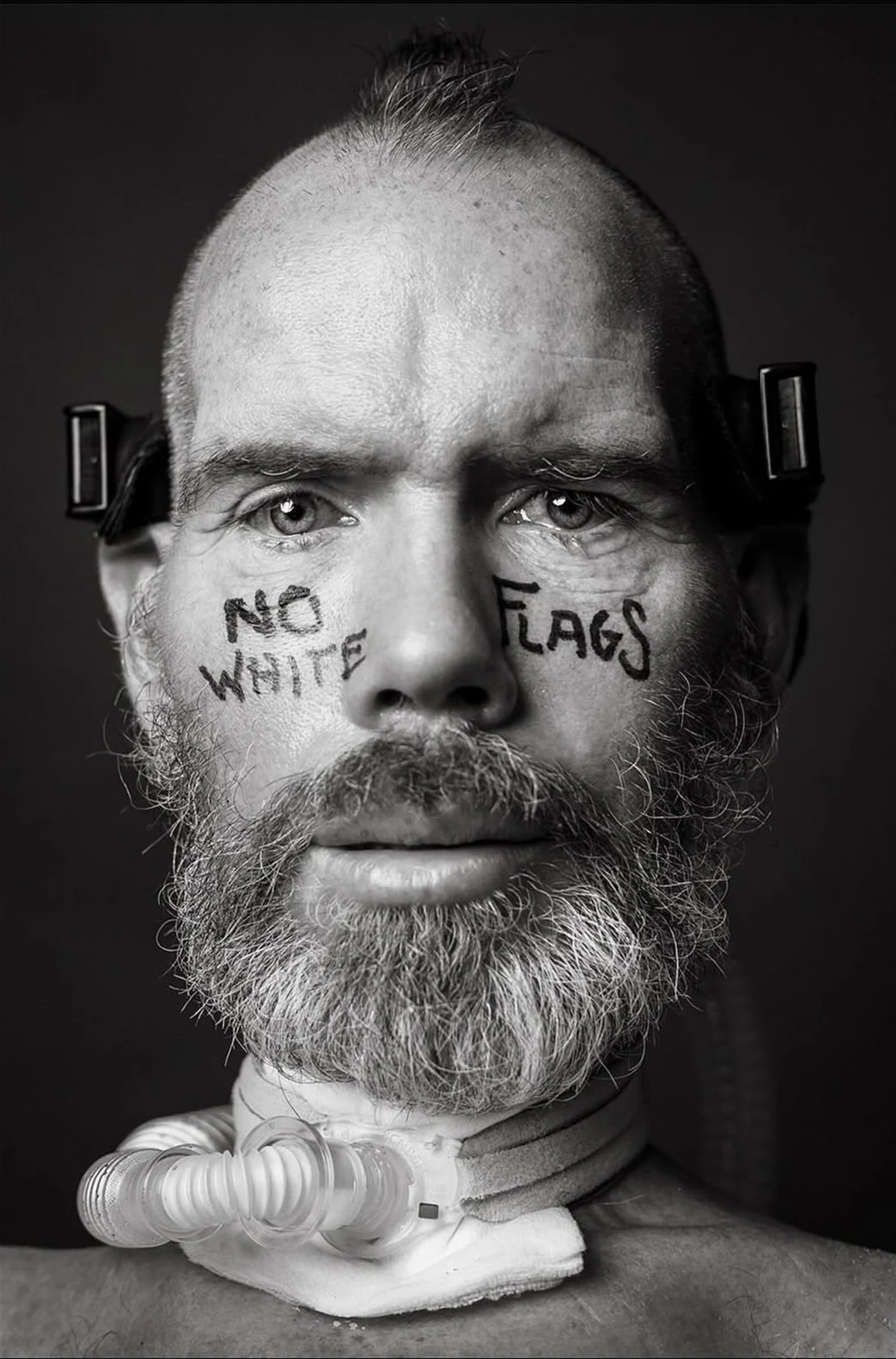 Steve Gleason, with No White Flags written on his face